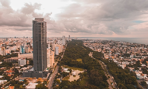 Cityscape with tall buildings and greenery