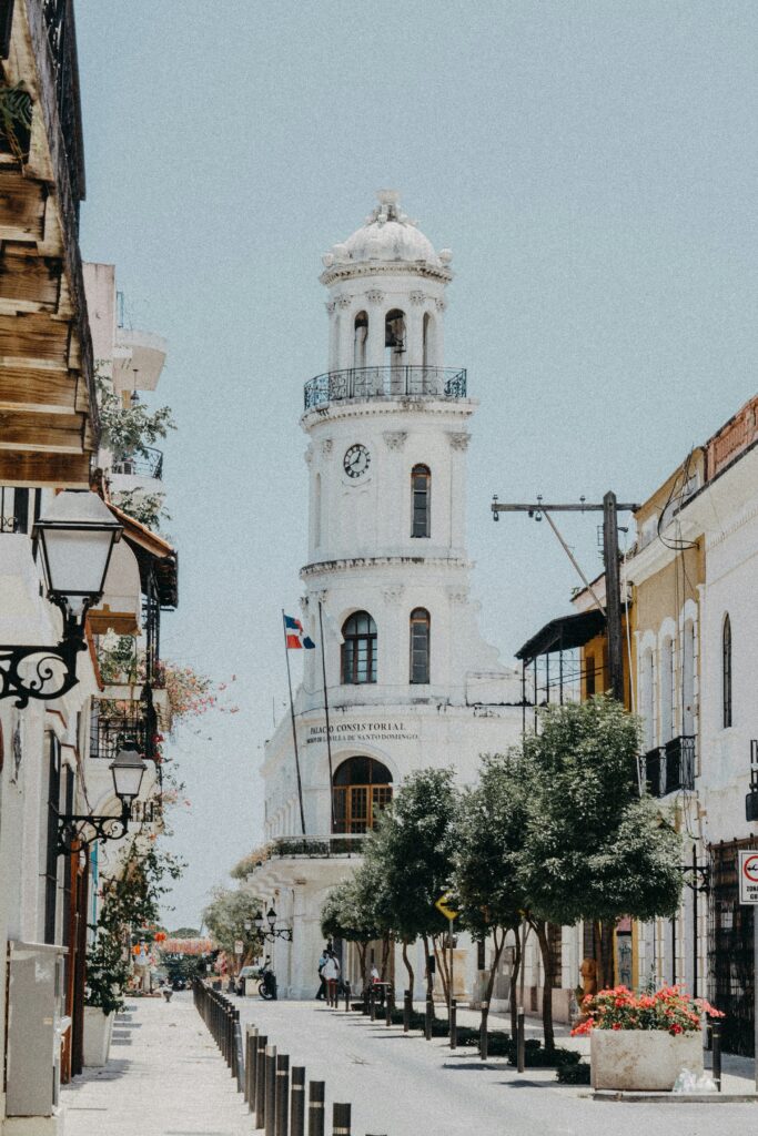 Historic clock tower in Santo Domingo street scene.